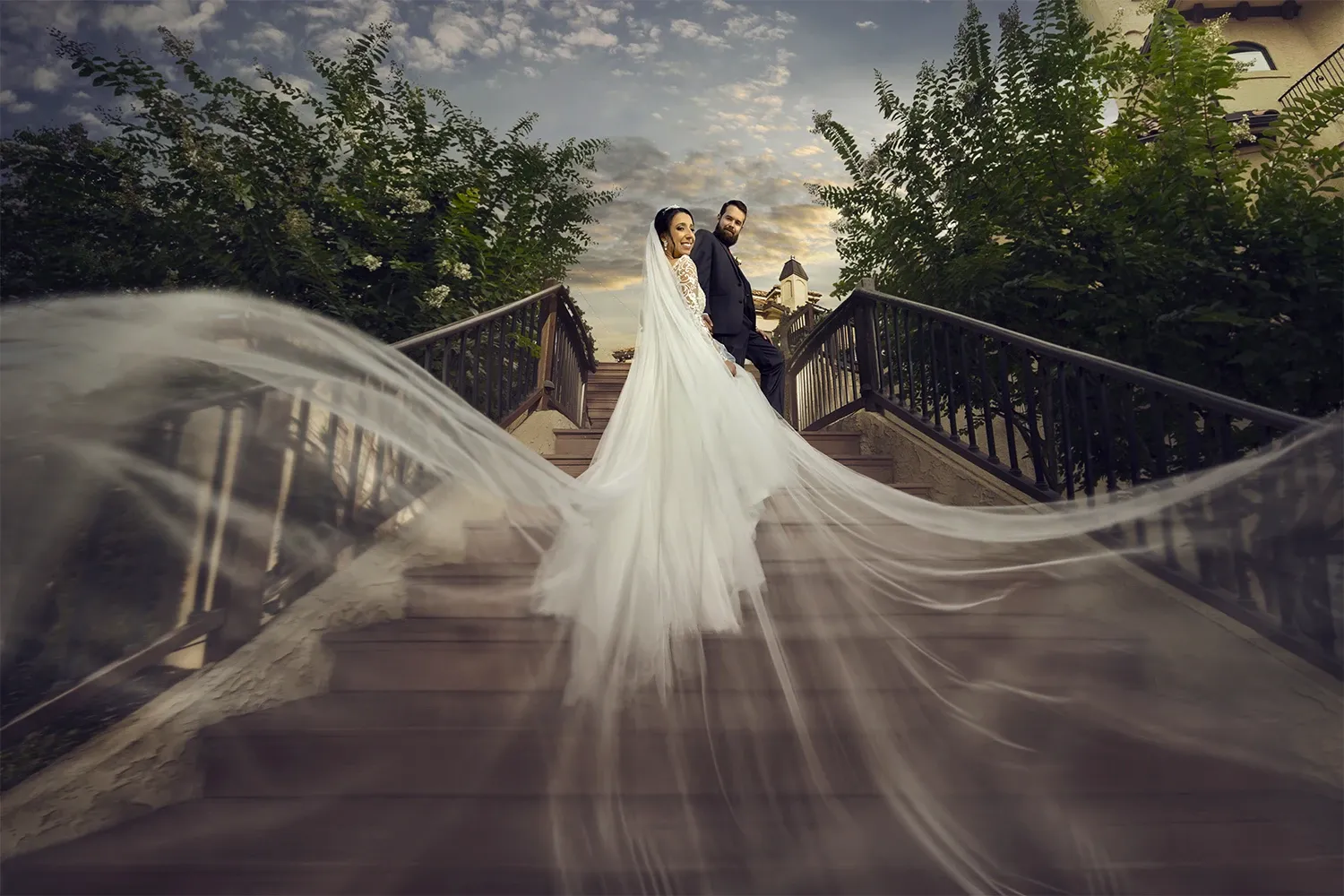 Bella Collina Mansion Wedding - Couple posing on outdoor stair case